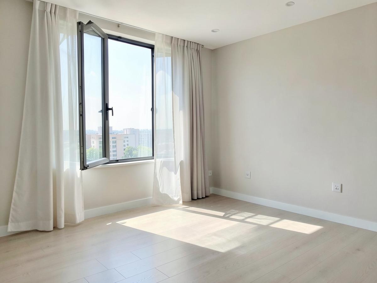Bright, freshly aired apartment room with an open window